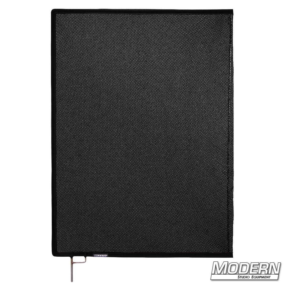 Lighting technician positioning Black Triple Scrim in front of fixture for precise exposure adjustment | Modern Studio Equipment